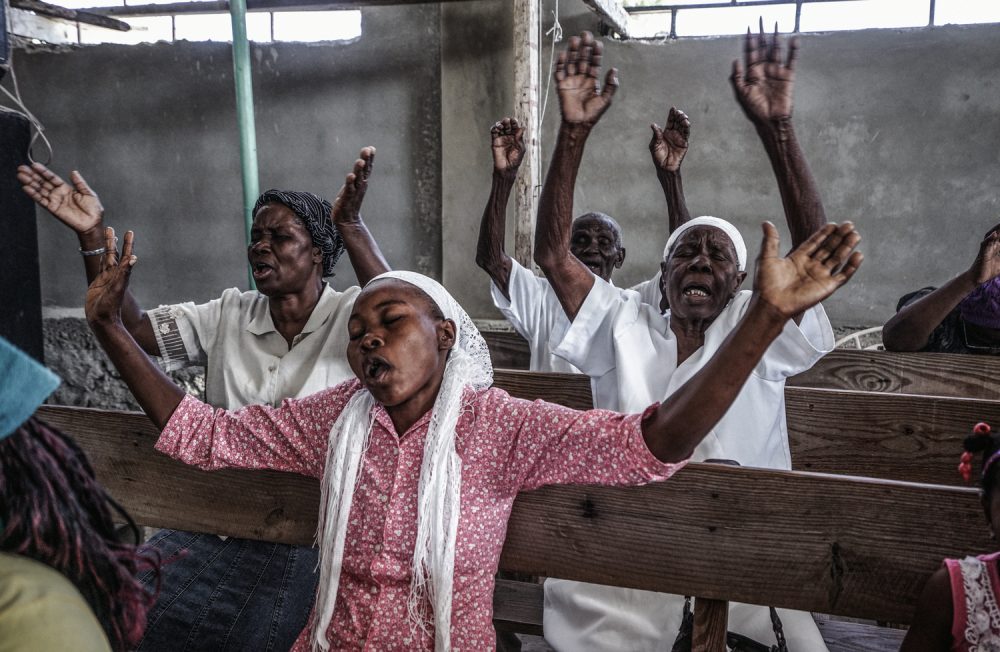 On the morning of the 5th anniversary of the 2010 earthquake, a group of local Port-Au-Prince residents in a chuch on the outskirts of Port-Au-Prince, Haiti.