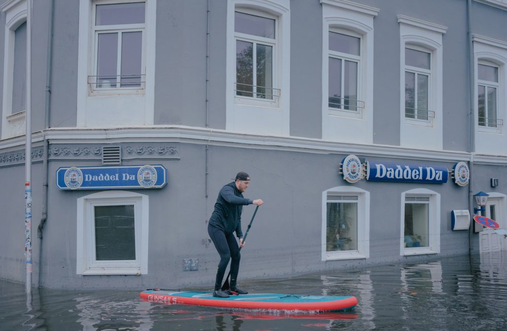 Lars floats a SUP through the flood the morning after the storm surge in Flensburg, Germany on October 21, 2023. Water levels in Flensburg rose to their highest level in over 100 years. The damage to the Baltic Sea coast is estimated to be in the hundreds of millions.